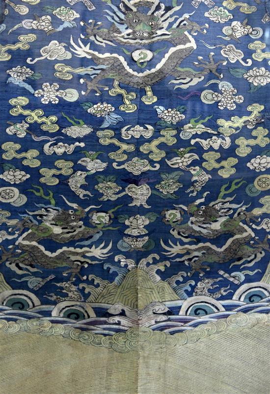 A Chinese blue silk kesi dragon panel, 17th century, 99cm x 61cm, wear and old repairs